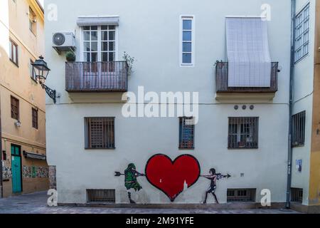 Graffiti on the wall of the historic district of Valencia. Spain. Stock Photo