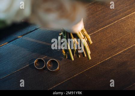 Designer wedding rings lying on the surface. Two wedding rings. Stock Photo