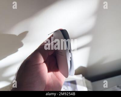 Paris, France - Oct 18, 2022: Side view of the deigned package of new Apple Watch Magnetic Fast Charger to USB-C cable Stock Photo