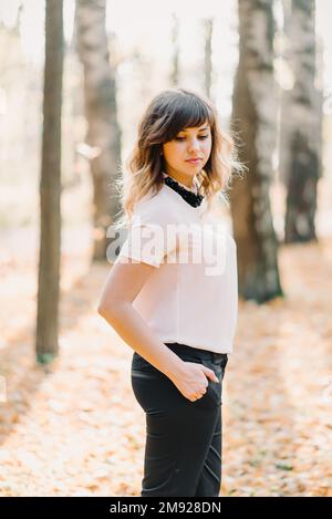 portrait of brunette girl Caucasian appearance in Park in autumn Stock Photo