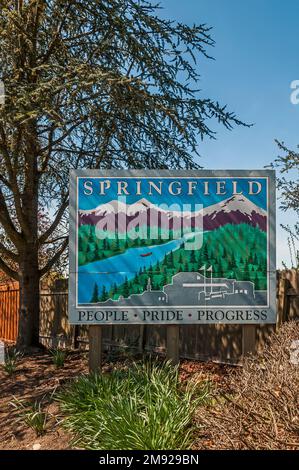 Springfield sign on McKenzie Highway in Springfield, Oregon.  The caption is People, Pride, Progress. Stock Photo