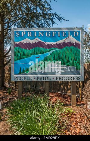 Springfield sign on McKenzie Highway in Springfield, Oregon.  The caption is People, Pride, Progress. Stock Photo