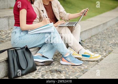 Cropped image of high school students working on project together Stock Photo