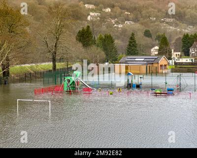 Taffs Well, Cardiff, Wales - January 2023: Children's playground in the village underwater after flooding from the River Taff Stock Photo