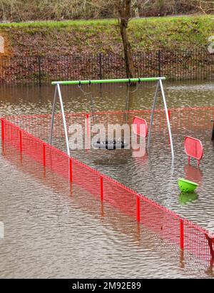 Taffs Well, Cardiff, Wales - January 2023: Children's playground in the village underwater after flooding from the River Taff Stock Photo