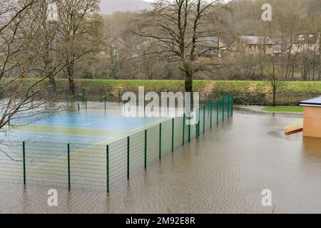 Taffs Well, Cardiff, Wales - January 2023: Village tennis court underwater after flooding from the River Taff Stock Photo