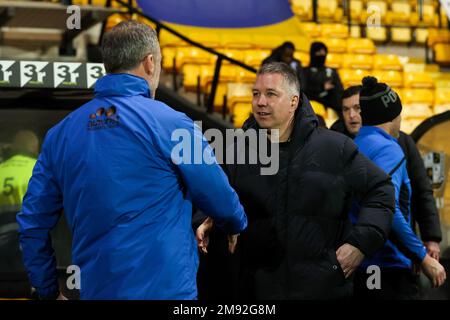 Peterborough United manager Darren Ferguson, taking charge of his first match after returning to the club for a fourth spell, shakes hands with Port Vale Manager Darrell Clarke before the Sky Bet League 1 match Port Vale vs Peterborough at Vale Park, Burslem, United Kingdom, 16th January 2023  (Photo by Nick Browning/News Images) Stock Photo