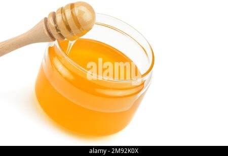 Honey pot and dipper isolated on white background as package design element. Free space for text. Stock Photo