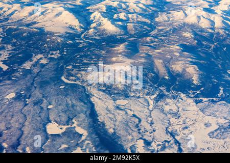 Aerial view of frozen mountains and rivers in the North Pole Stock Photo