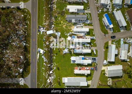 Destroyed by hurricane Ian suburban houses in Florida mobile home residential area. Consequences of natural disaster Stock Photo