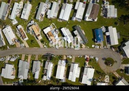 Destroyed by hurricane Ian suburban houses in Florida mobile home residential area. Consequences of natural disaster Stock Photo