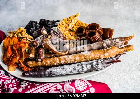 From above traditional georgian dessert set with dried fruits, nuts, and churchkhela Stock Photo