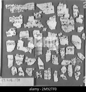 Eight Groups of Papyrus Fragments Inscribed in Demotic and Greek Eight Groups of Papyrus Fragments Inscribed in Demotic and Greek, 664 B.C.E.-395 C.E. Papyrus, ink, 47.218.17a-3: Largest fragment: 2 9/16 × 1 9/16 in. (6.5 × 4 cm).   Egyptian, Classical, Ancient Near Eastern Art 664 B.C.E.-395 C.E. Stock Photo