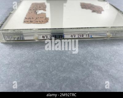 Eight Groups of Papyrus Fragments Inscribed in Demotic and Greek Eight Groups of Papyrus Fragments Inscribed in Demotic and Greek, 664 B.C.E.-395 C.E. Papyrus, ink, 47.218.17a-3: Largest fragment: 2 9/16 × 1 9/16 in. (6.5 × 4 cm).   Egyptian, Classical, Ancient Near Eastern Art 664 B.C.E.-395 C.E. Stock Photo