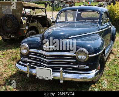 Sainte-Mere-Eglise, Normandy, France, June, 03, 2019 A historic WWII era Plymouth built in 1944 is parked in a meadow Stock Photo