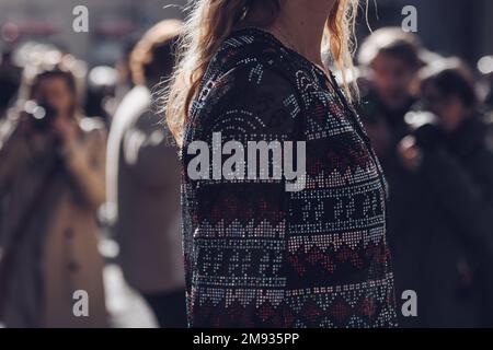 Milan, Italy - February 26, 2022: Woman wearing an ornamental top. Stock Photo
