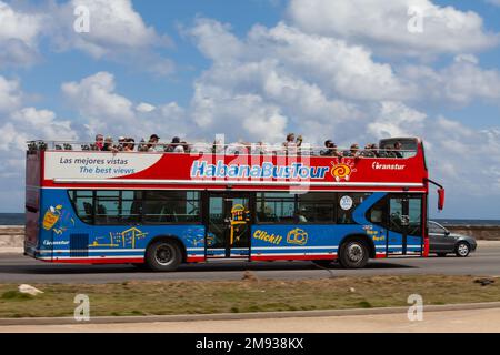 Transtur, Habana Bus Tour hop on hop off double decker tourist bus taking tourists sightseeing along the Malecon, Havana, Cuba Stock Photo