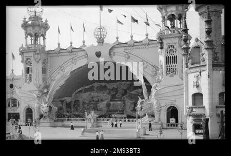 Luna Park, Coney Island Eugene Wemlinger. Luna Park, Coney Island, 1906. Cellulose nitrate negative, 5 3/4 x 3 1/2 in. (14.6 x 8.9 cm).  The Dragon’s Gorge was an enclosed roller coaster, a scenic railroad that brought the passenger on a fantastic trip from the bottom of the sea, through a waterfall, to the North Pole, Africa, the Grand Canyon, and even into Hades, the kingdom of death, over the river Styx. Two dragons framed the entrance, their eyes glowing from globes of green electric light. The ride caught fire in 1944, ultimately leading to the closing of the park two years later.  1906 Stock Photo