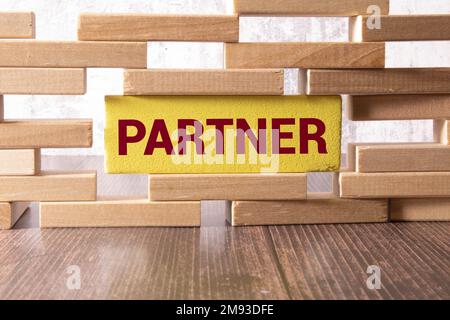 PARTNER word made with building wooden blocks on light background Stock Photo