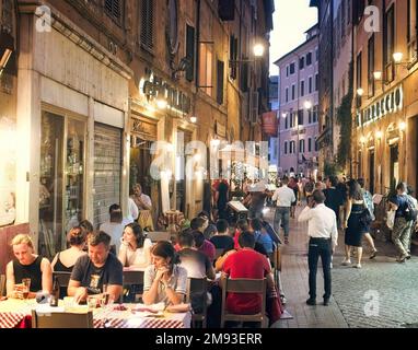 A busy street at night in Rome, Italy Stock Photo