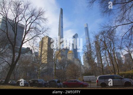 Winter view looking south through the barren trees at the southern end of Central Park in Manhattan, New York City. Stock Photo