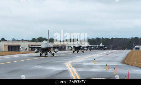 U.S. Air Force F-16C Fighting Falcons from 177th Fighter Wing taxi to the runway at the Atlantic City Air National Guard Base, New Jersey, before taking off to participate in the Weapons System Evaluation Program at Tyndall Air Force Base, Fla. Jan. 13, 2023. WSEP was created to test air-to-air and air-to-ground live-fire weapons. (U.S. Air National Guard photo by Senior Airman Hunter Hires) Stock Photo