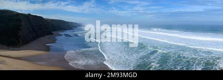 Magoito Beach on Atlantic ocean during storm and high waves, beautiful sandy beach on Sintra coast, Lisbon district, Portugal, part of Sintra-Cascais Stock Photo