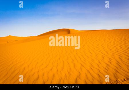 Majestic beautiful scene of Merzouga dunes of Sahara desert Morocco. Stock Photo