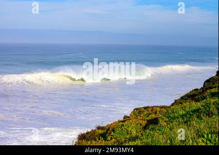 Magoito Beach on Atlantic ocean during storm and high waves, beautiful sandy beach on Sintra coast, Lisbon district, Portugal, part of Sintra-Cascais Stock Photo