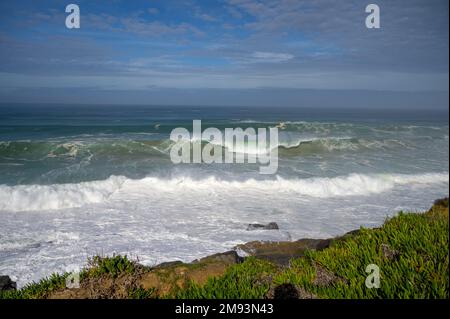 Magoito Beach on Atlantic ocean during storm and high waves, beautiful sandy beach on Sintra coast, Lisbon district, Portugal, part of Sintra-Cascais Stock Photo