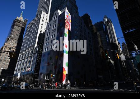 View of the Yayoi Kusama robot painting spots on the window of the luxury  retailer Louis Vuitton's Fifth Avenue store, New York, NY, January 9, 2023.  This is the second time that