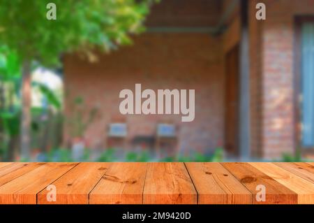 perspective wooden brown board over blurred brick wall Stock Photo