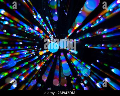 Colorful abstract circles in a radiating pattern against a black background Stock Photo
