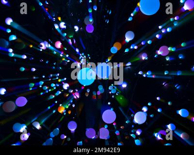 Colorful abstract circles in a radiating pattern against a black background Stock Photo