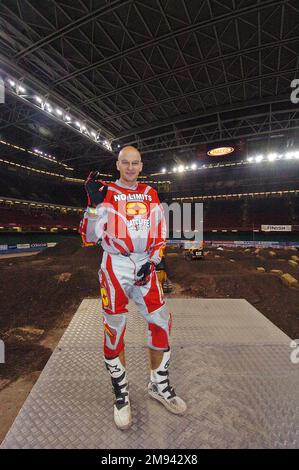 Stunt motorcycle rider Jason Rennie doing his record breaking jump at the end of round four of the Maxxis British Supercross Championship at the Millennium Stadium in Cardiff on 4th December 2004. Stock Photo