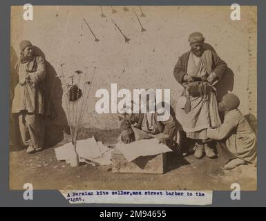 A Persian Kite Seller and Street Barber, One of 274 Vintage Photographs , late 19th-early 20th century. Albumen silver photograph, 6 1/8 x 8 3/16 in. (15.5 x 20.8 cm).   Arts of the Islamic World late 19th-early 20th century Stock Photo