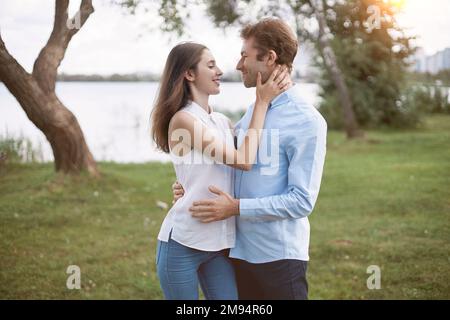 man and a woman in love tenderly looking at each other . Stock Photo