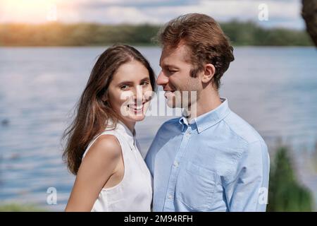 young couple kisses during a country walk . Stock Photo