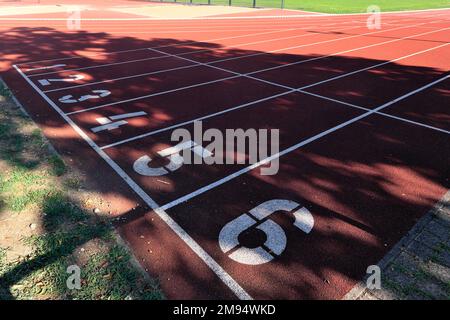 Starting places 1 to 6 on a tartan running track, Munich, Bavaria, Germany Stock Photo