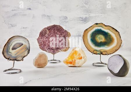 Collection of semi-precious stones of different colors and patterns on white background Stock Photo