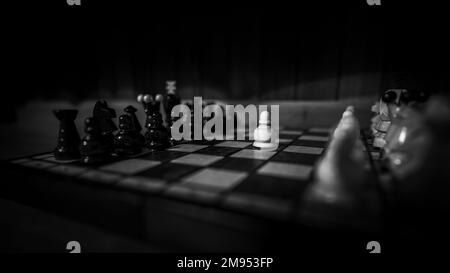 The set of wooden chess pieces element, king, queen rook, bishop, knight, pawn standing on chess board on dark background. Leadership, teamwork Stock Photo