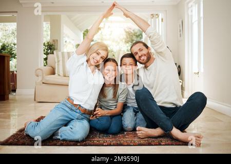 Making sure that theyre safe. a young couple ensuring that their familys home is covered. Stock Photo