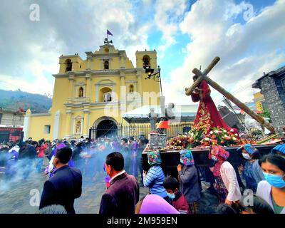 Holy Week Procession in Rural Mayan Kaqchikel village, San Antonio Aguas Calientes, near Antigua Guatemala with people wearing masks Stock Photo