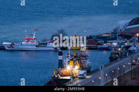 Sassnitz, Germany. 17th Jan, 2023. Ships are moored in the city harbor and are being prepared for their next deployment before sunrise. The winter weather in northern Germany is currently stormy and chilly. Credit: Jens Büttner/dpa/Alamy Live News Stock Photo
