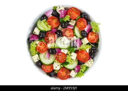 Greek salad with fresh tomatoes olives and feta cheese healthy eating food from above isolated on white eat Stock Photo