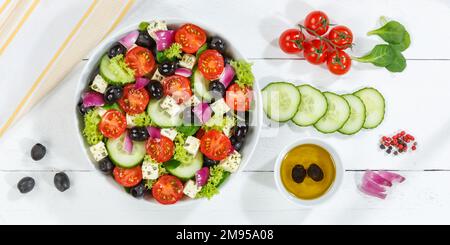 Greek salad with fresh tomatoes olives and feta cheese healthy eating food from above banner on a wooden board eat Stock Photo