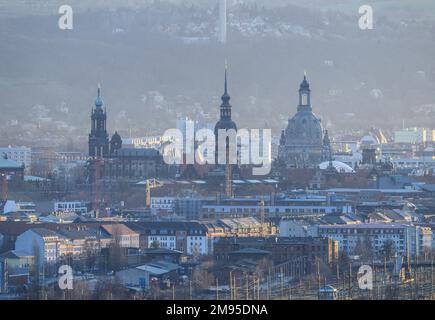 Dresden, Germany. 17th Jan, 2023. View in the morning during sunrise on the old town with the Hofkirche (l-r), the dome of the Academy of Arts with the angel 'Fama', the Georgentor, the Hausmannsturm and the Frauenkirche. Credit: Robert Michael/dpa/Alamy Live News Stock Photo
