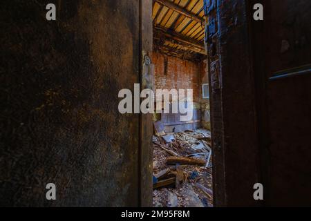 Shabby abandoned building with wooden doors Stock Photo - Alamy
