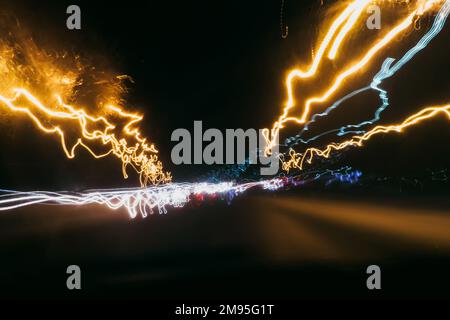 blurred abstract traces of bright night lights of cars Stock Photo