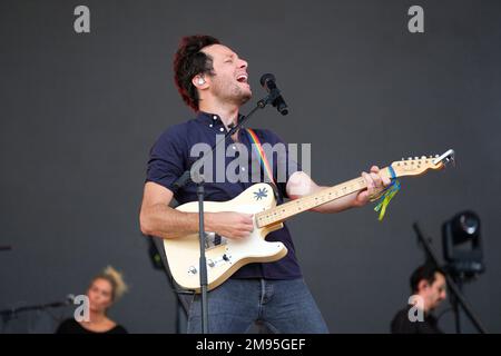 Carhaix (Brittany, north-western France), July 17, 2022: singer Vianney on stage and crowd of festival-goers on the occasion of the Vieilles Charrues Stock Photo